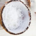 How do you scrape a coconut easily?
